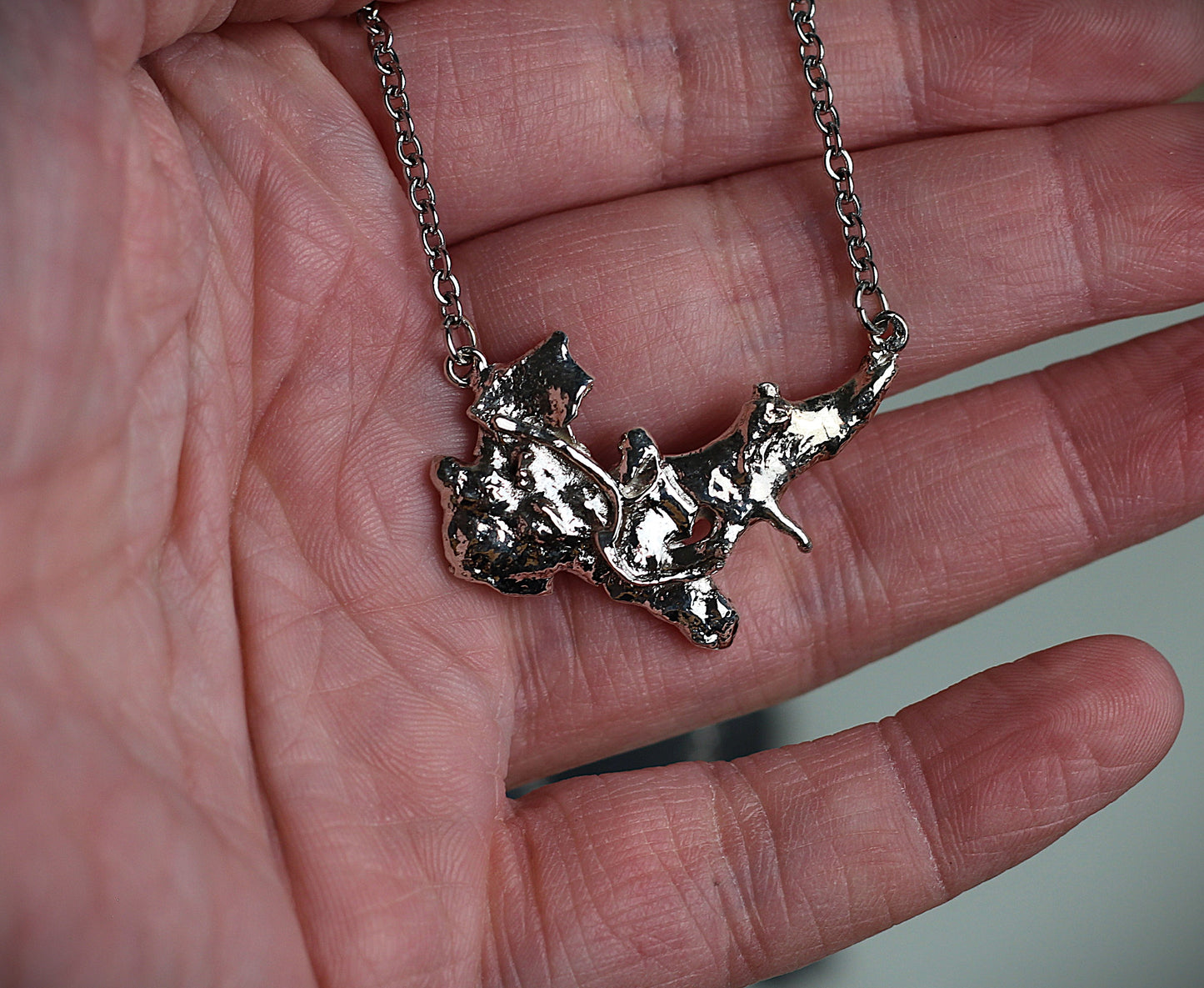 One-of-a-kind slow jewelry masterpiece featuring a heavy molten silver texture. Handcrafted from Alpenjuwel