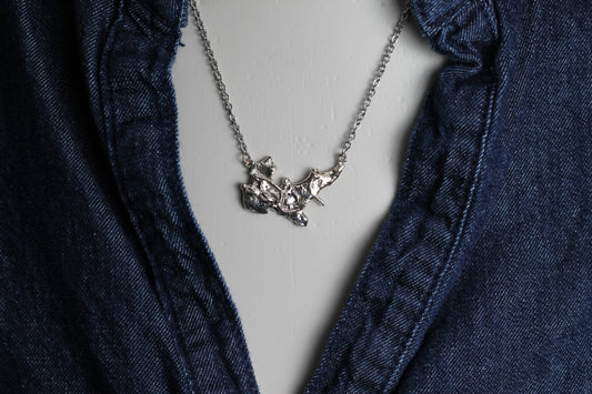 Unique handcrafted silver talisman with a volcanic molten finish  showcasing authentic Austrian jewelry craftsmanship.
